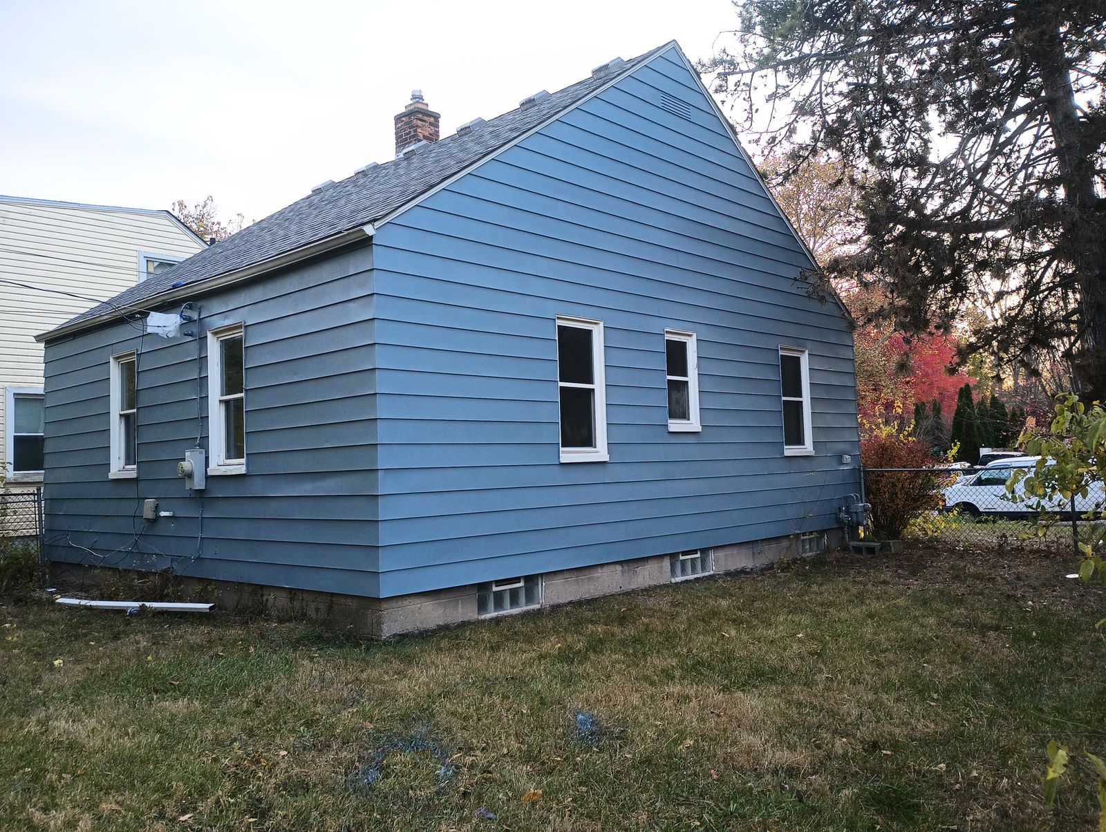 Finished blue house exterior, gable end