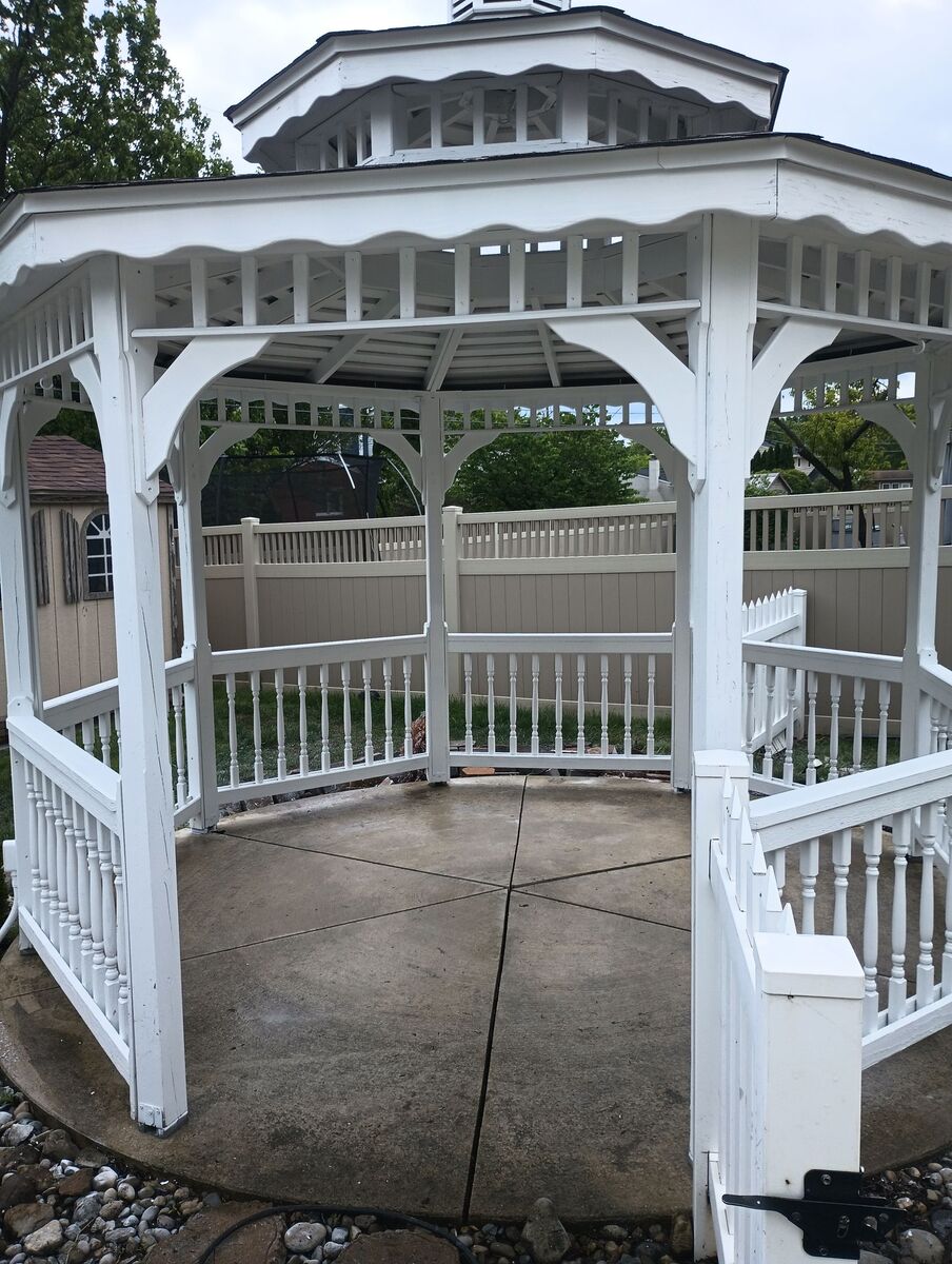 Gazebo after repaint, clean white finish, side angle