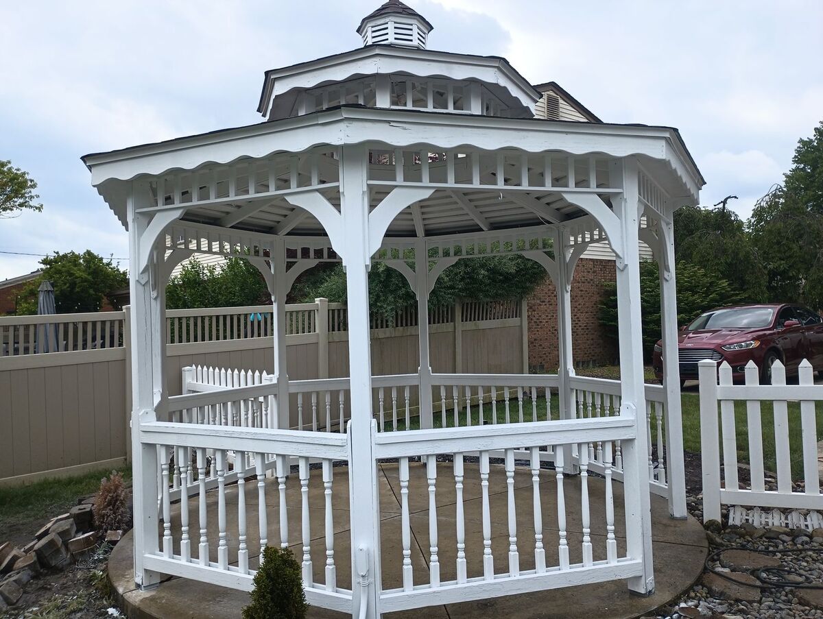 Gazebo after repaint, clean white finish, front angle
