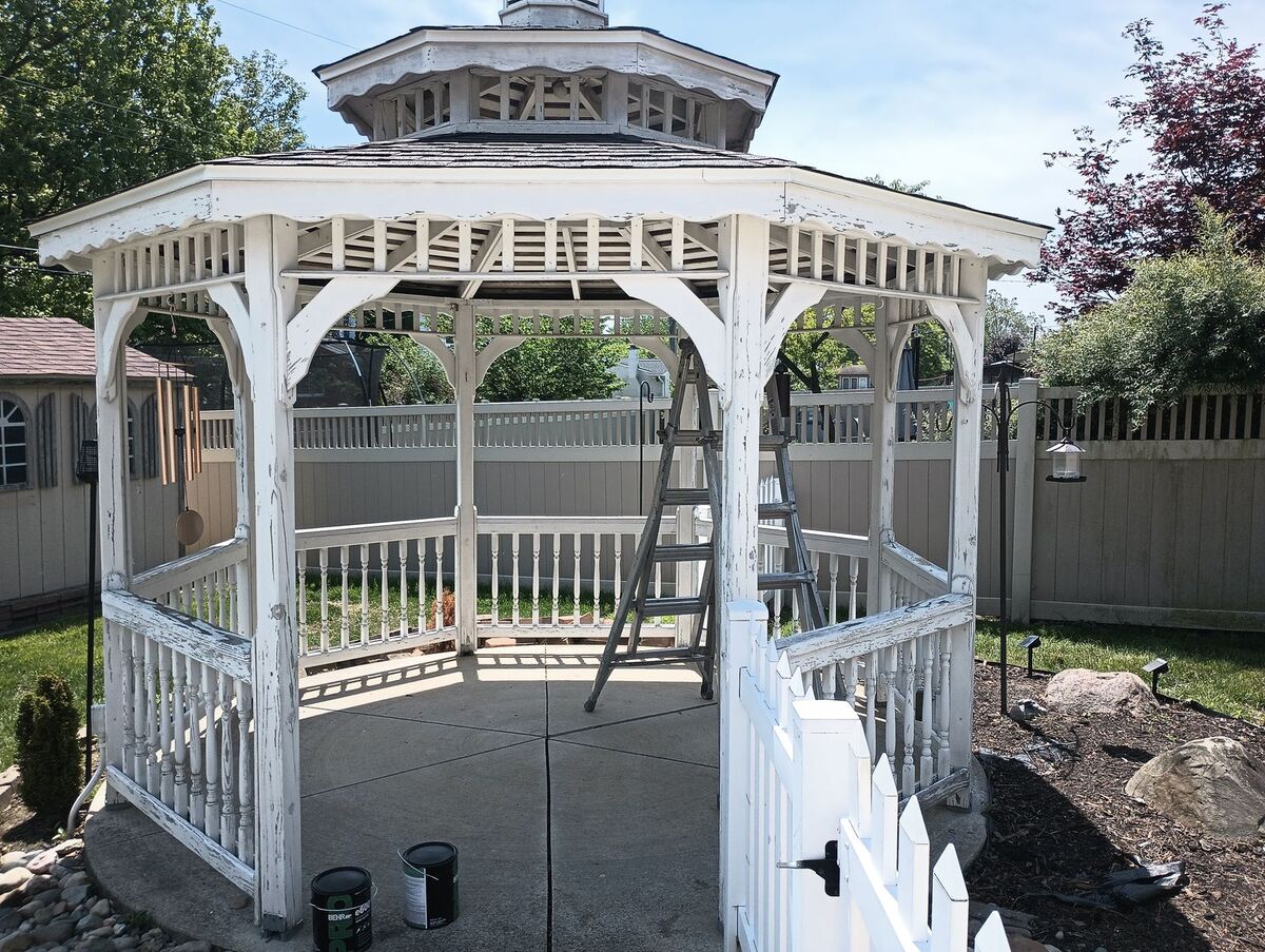 Same gazebo before repaint, heavily peeling old white paint, front angle