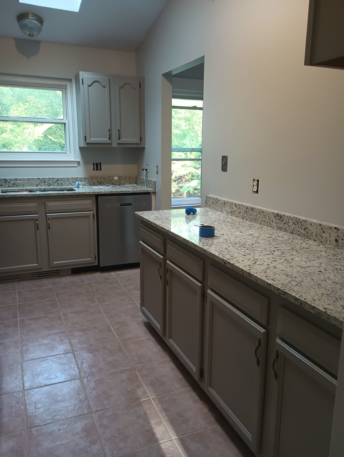Finished cabinets, second angle showing island fronts and upper doors
